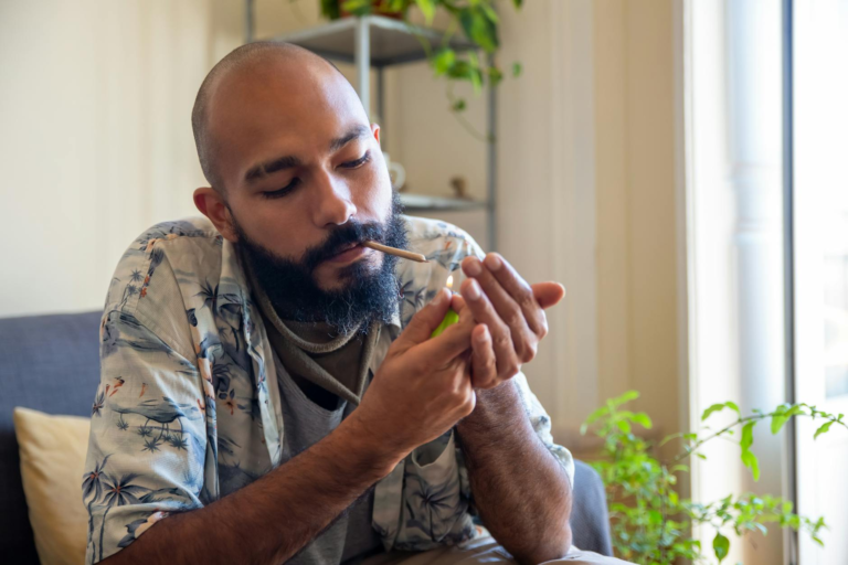 a man lighting cigarete